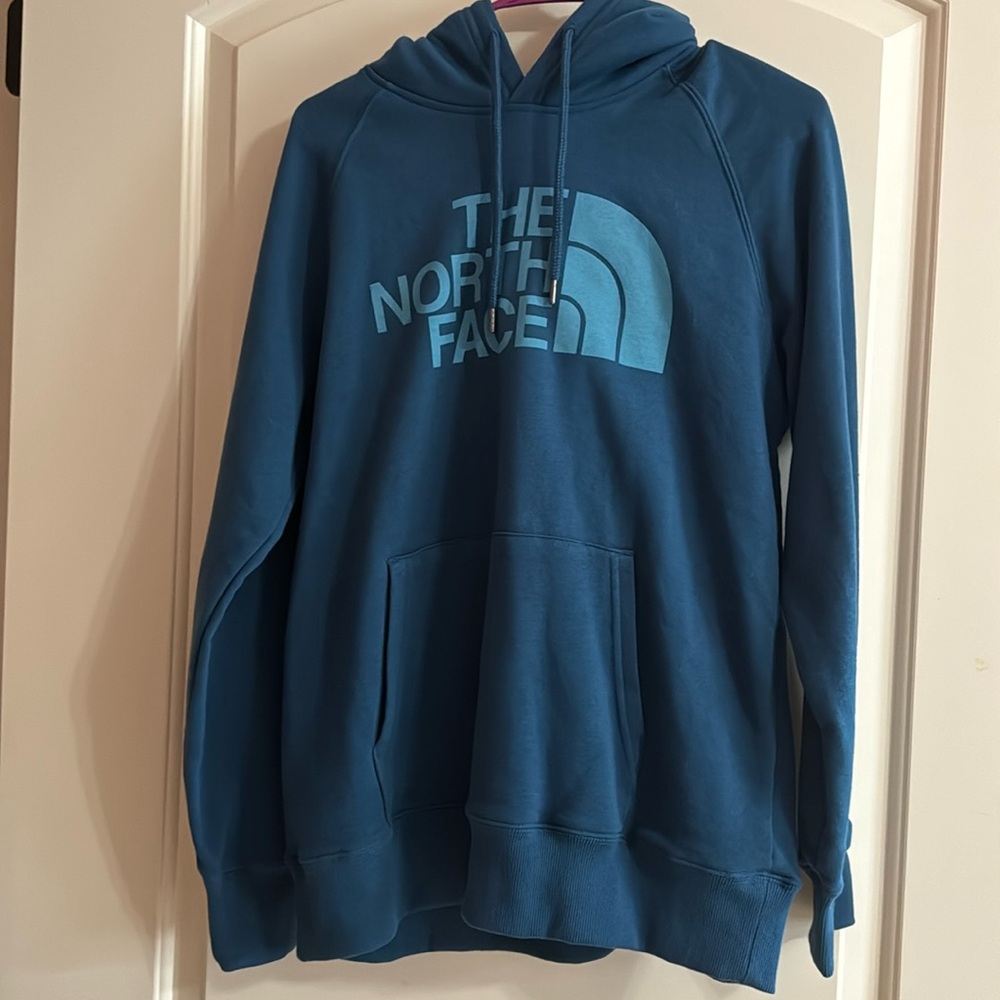 Blue north face hoodie. New with tags. Size medium.